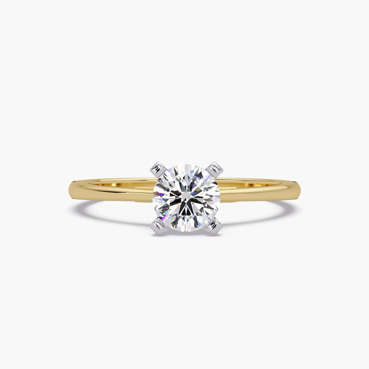 Close-up of a round lab-grown diamond solitaire ring in 18K yellow gold with a prong setting. Minimalist design with a high-polish gold band, perfect for promise, engagement, or everyday wear.