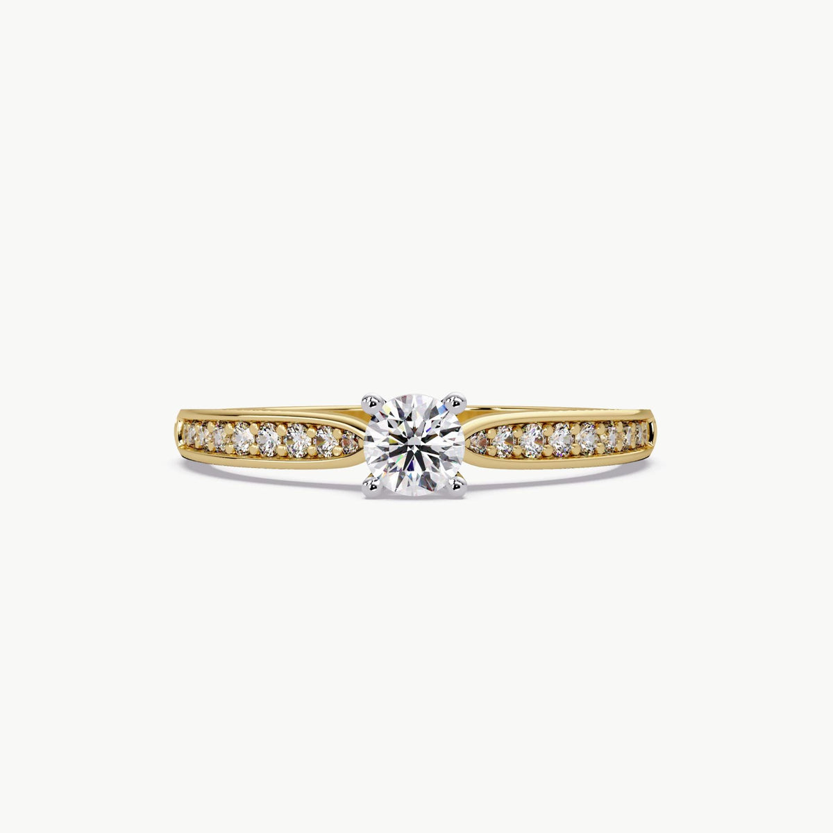18K yellow gold solitaire ring featuring a round lab-grown diamond center stone with pavé channel-set side diamonds and a tapered shank, designed as a dainty promise or engagement ring.