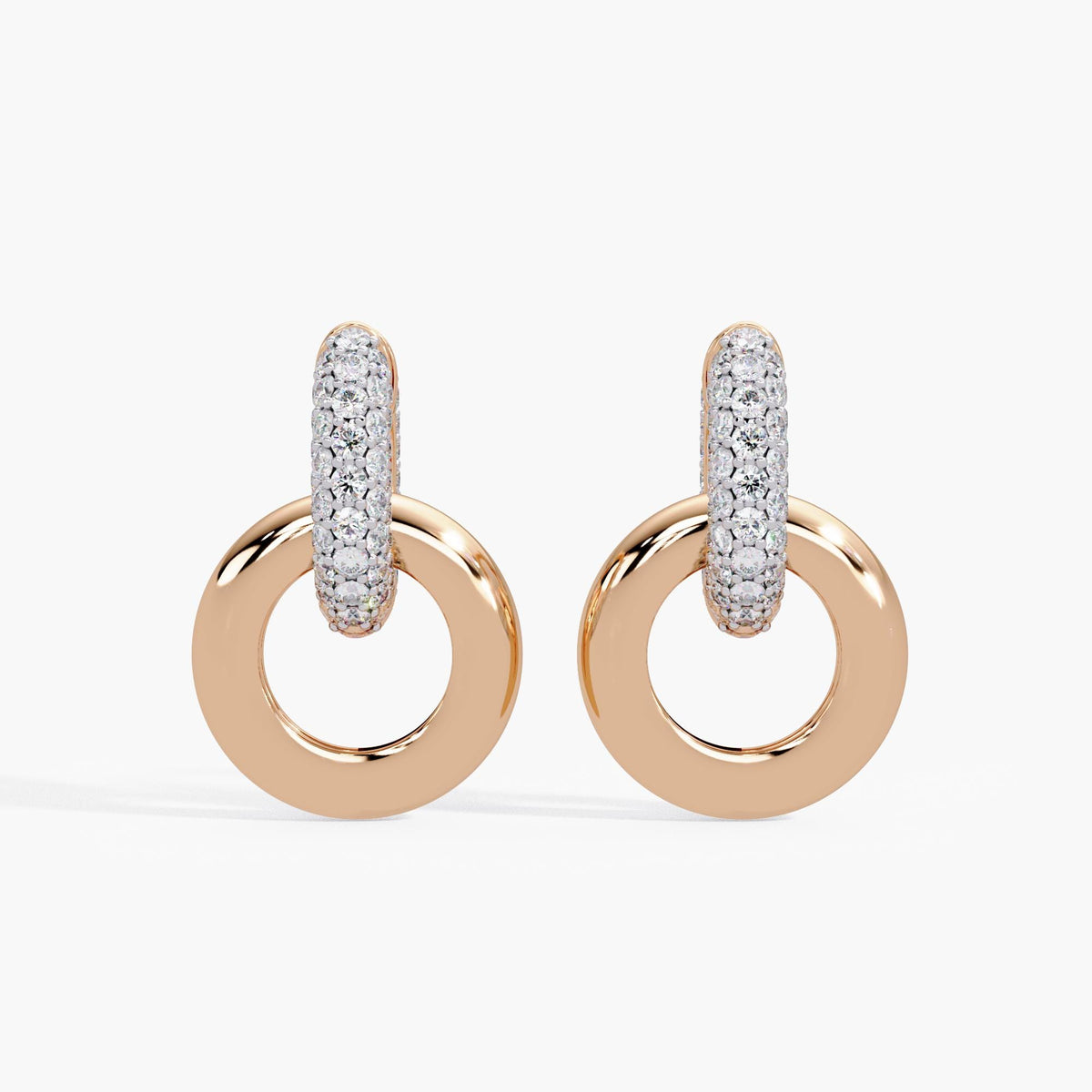 14K rose gold earrings with pave diamond huggies and gold circle drops.