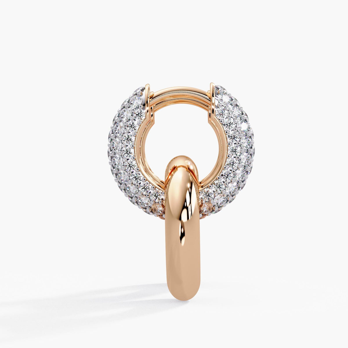 14K rose gold convertible earrings with hinged clasp and a removable high-shine drop. The pavé diamond huggies curves with brilliance, while the sleek circle ring below adds warmth and weight.