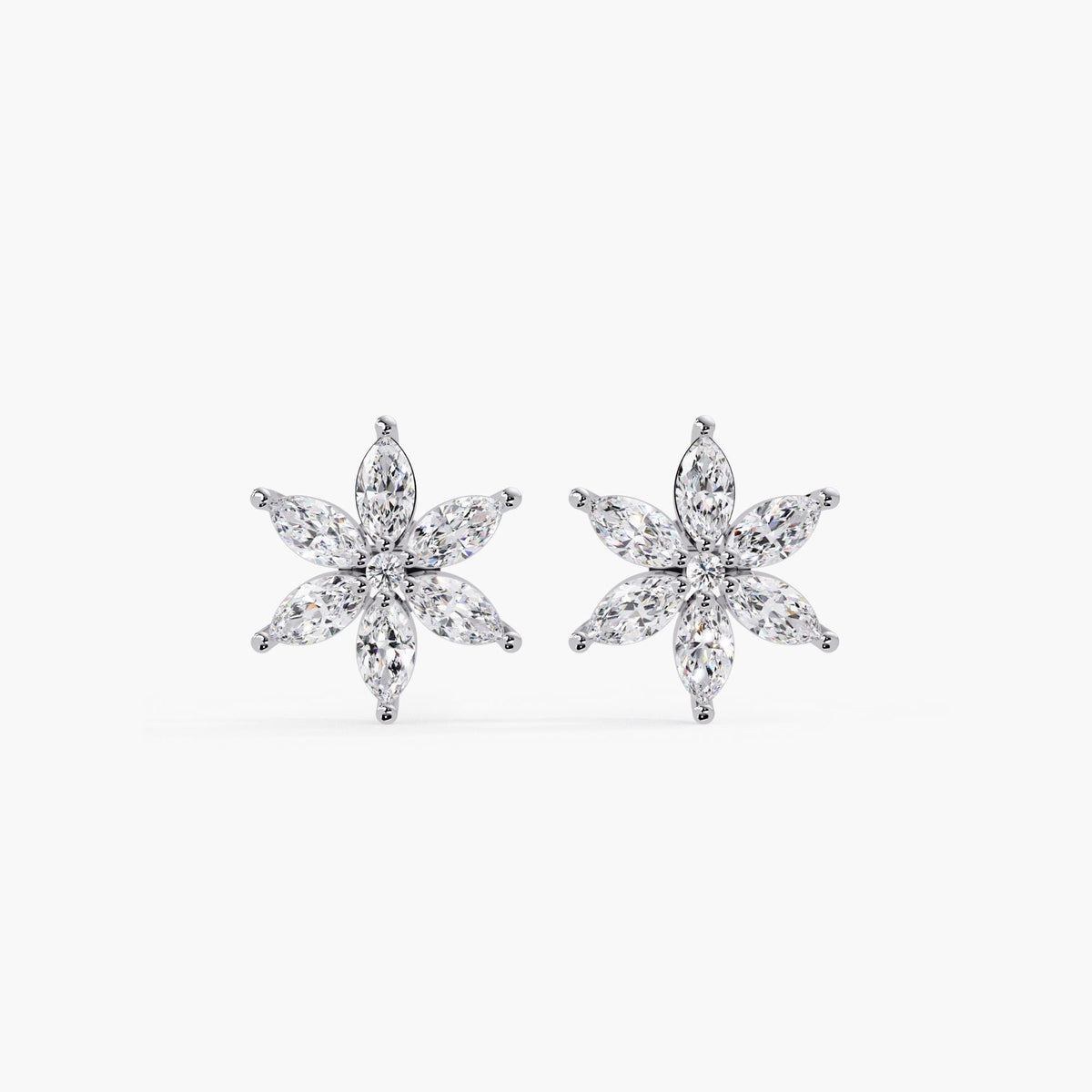 Front view of white gold marquise diamond floral stud earrings featuring six marquise-cut diamonds arranged in a symmetrical flower design, dainty and elegant fine jewelry for daily wear or special occasions