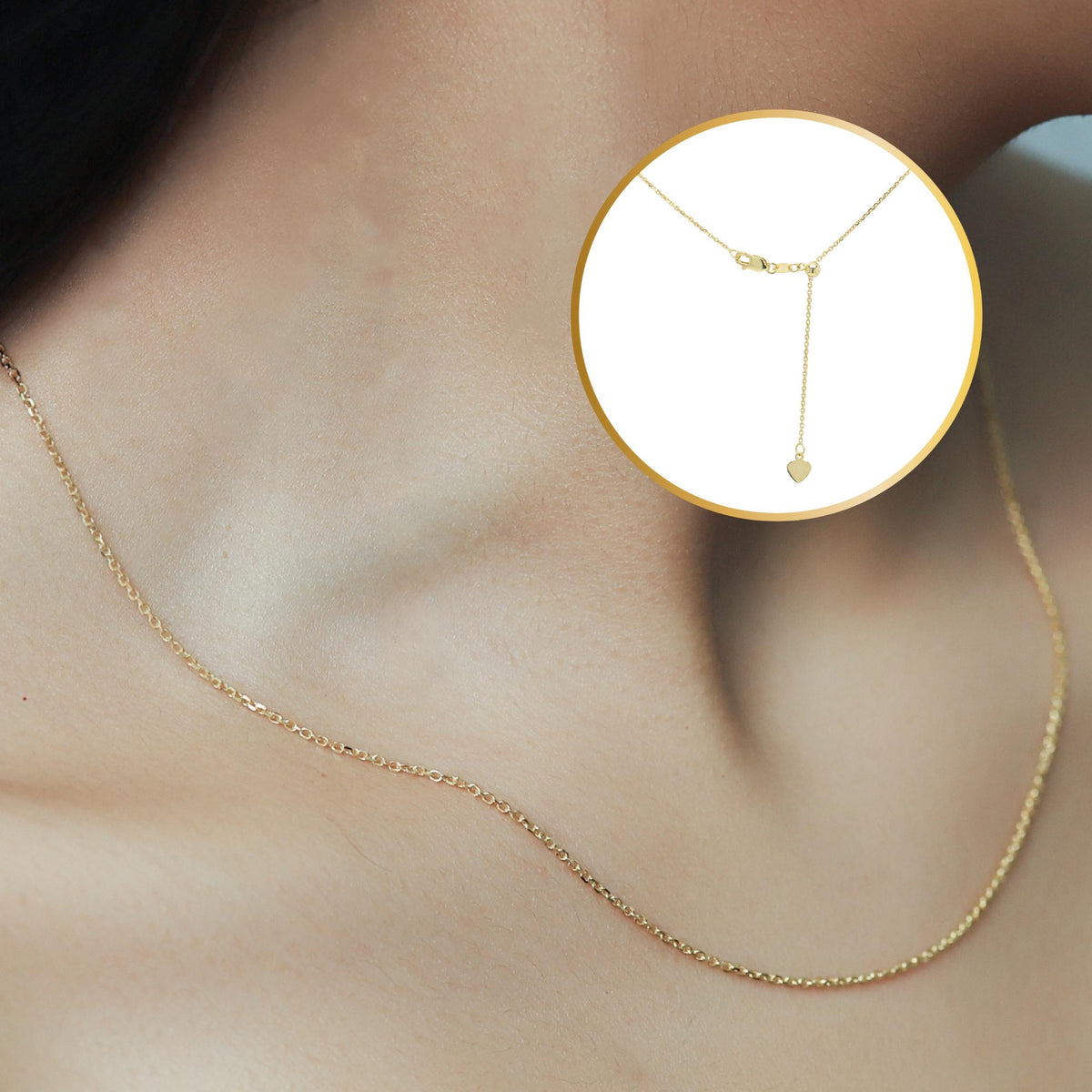 14k solid gold adjustable cable chain necklace worn on neck, featuring 0.9mm diamond-cut links and a lobster clasp with heart drop detail, ideal for layering or for charm necklace