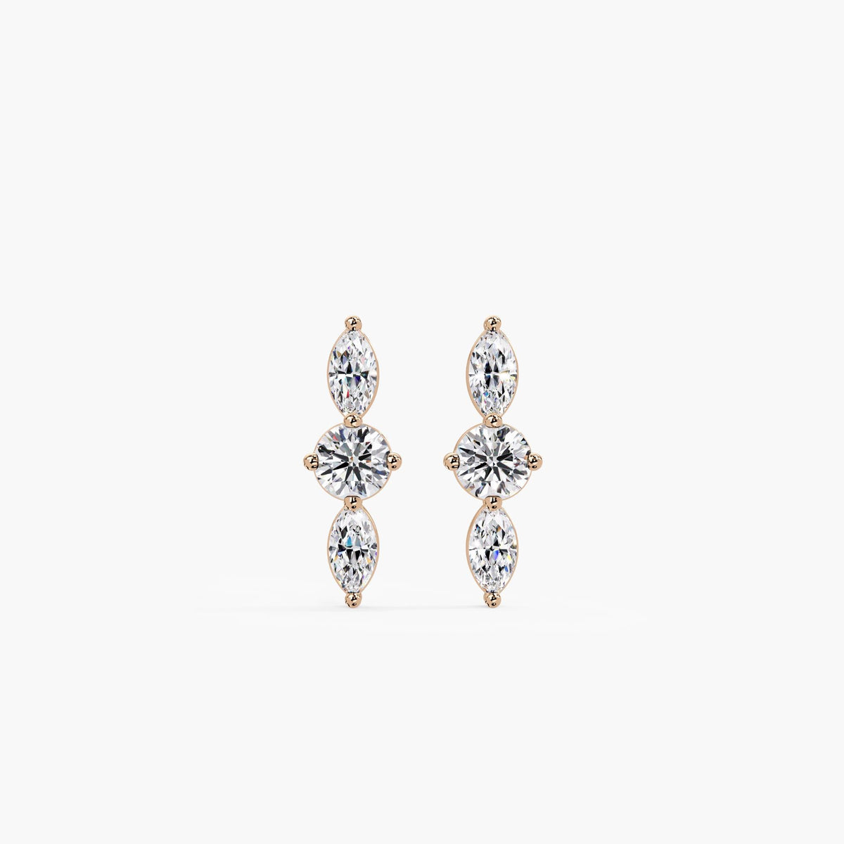 14K rose gold stud earrings featuring a round lab-grown diamond centered between two marquise diamonds in a vertical three-stone setting, front view