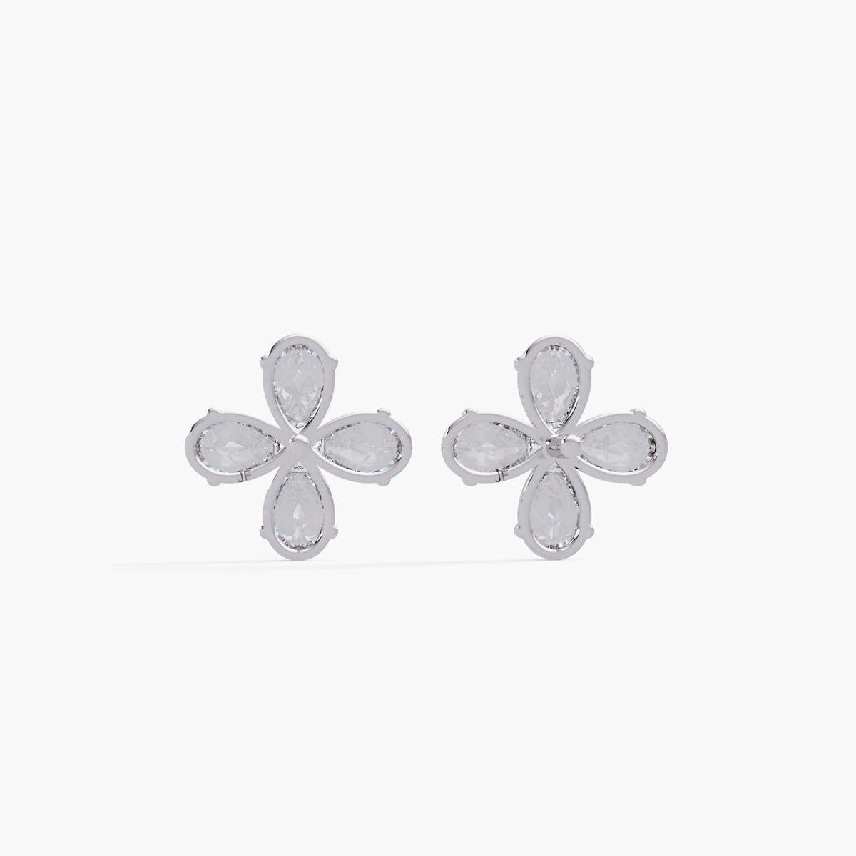 14K white gold floral stud earrings showcasing the open basket-style prong setting. The earrings feature four pear-shaped diamonds arranged in a daisy-like cluster, highlighting clean craftsmanship and secure backing design.