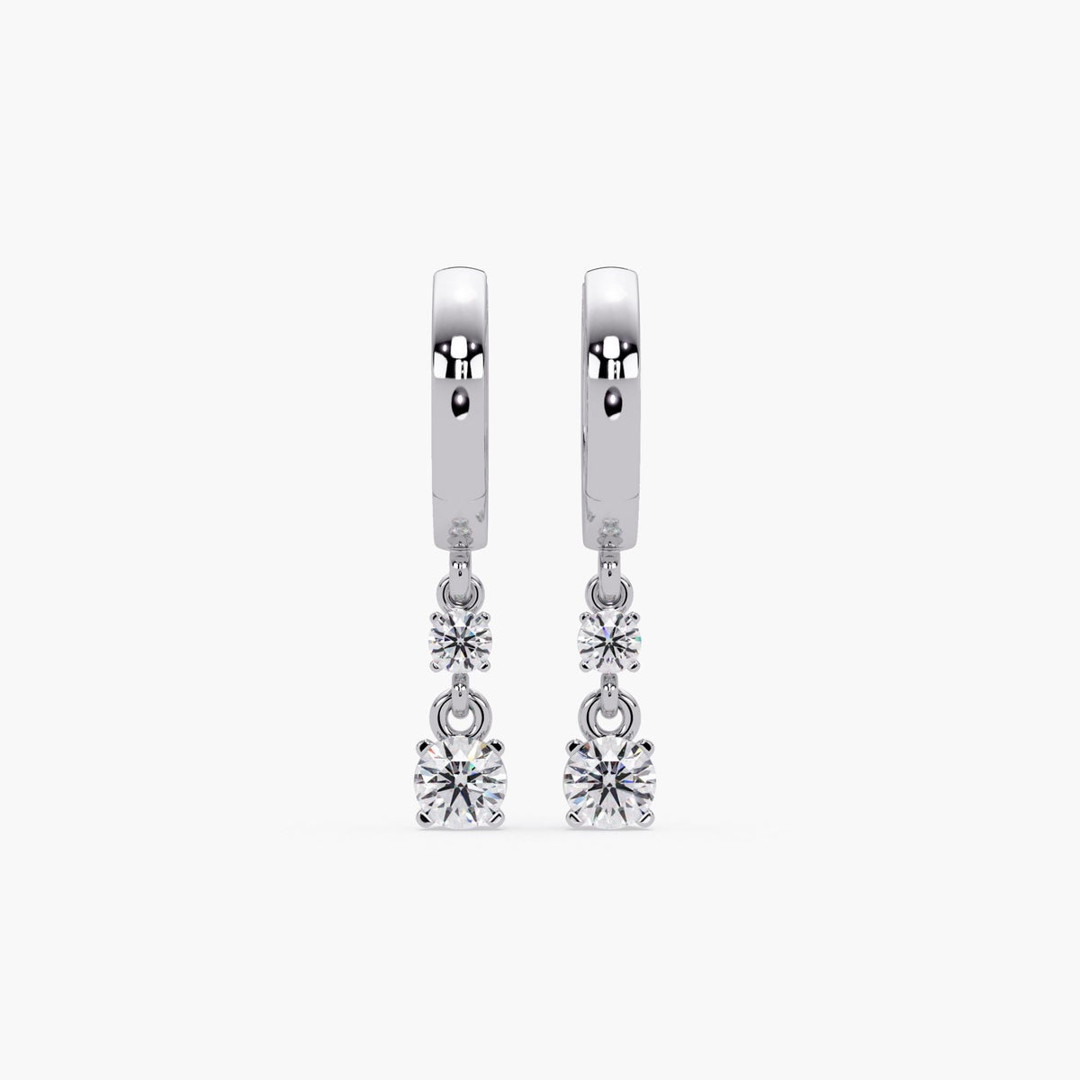 14K white gold huggie earrings featuring two round lab-grown diamonds per earring in a vertical prong-set drop design