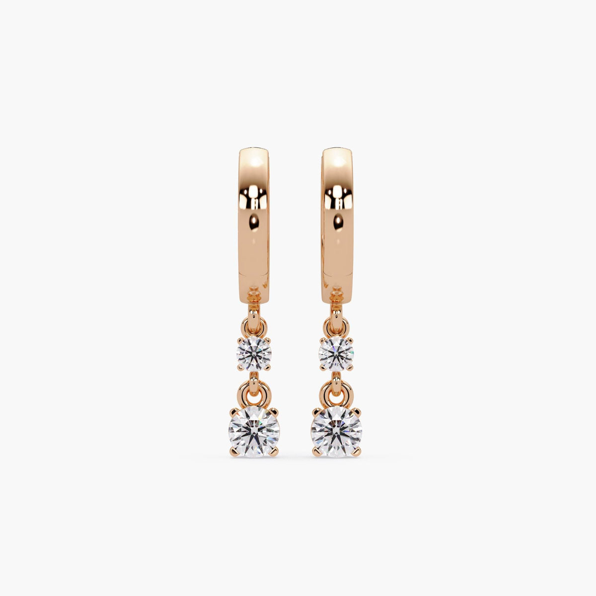 14K rose gold huggie earrings featuring two round lab-grown diamonds on each earring; diamonds are prong-set and dangle vertically for added sparkle and movement.









Ask ChatGPT