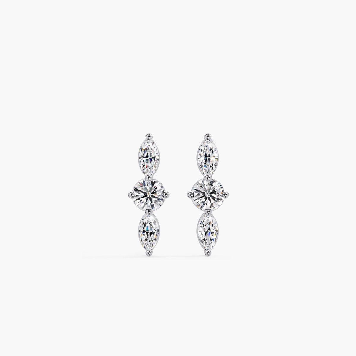 14K gold three-stone stud earrings featuring a round lab-grown diamond centered between two marquise diamonds in a vertical arrangement.