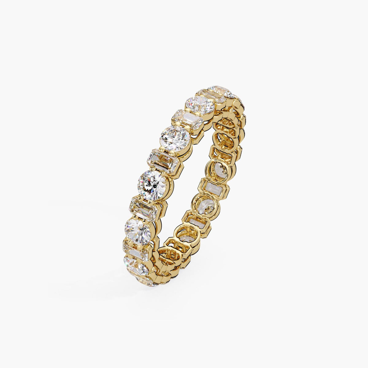 14K yellow gold eternity ring featuring alternating prong-set round and emerald-cut lab-grown diamonds. A low set wedding band