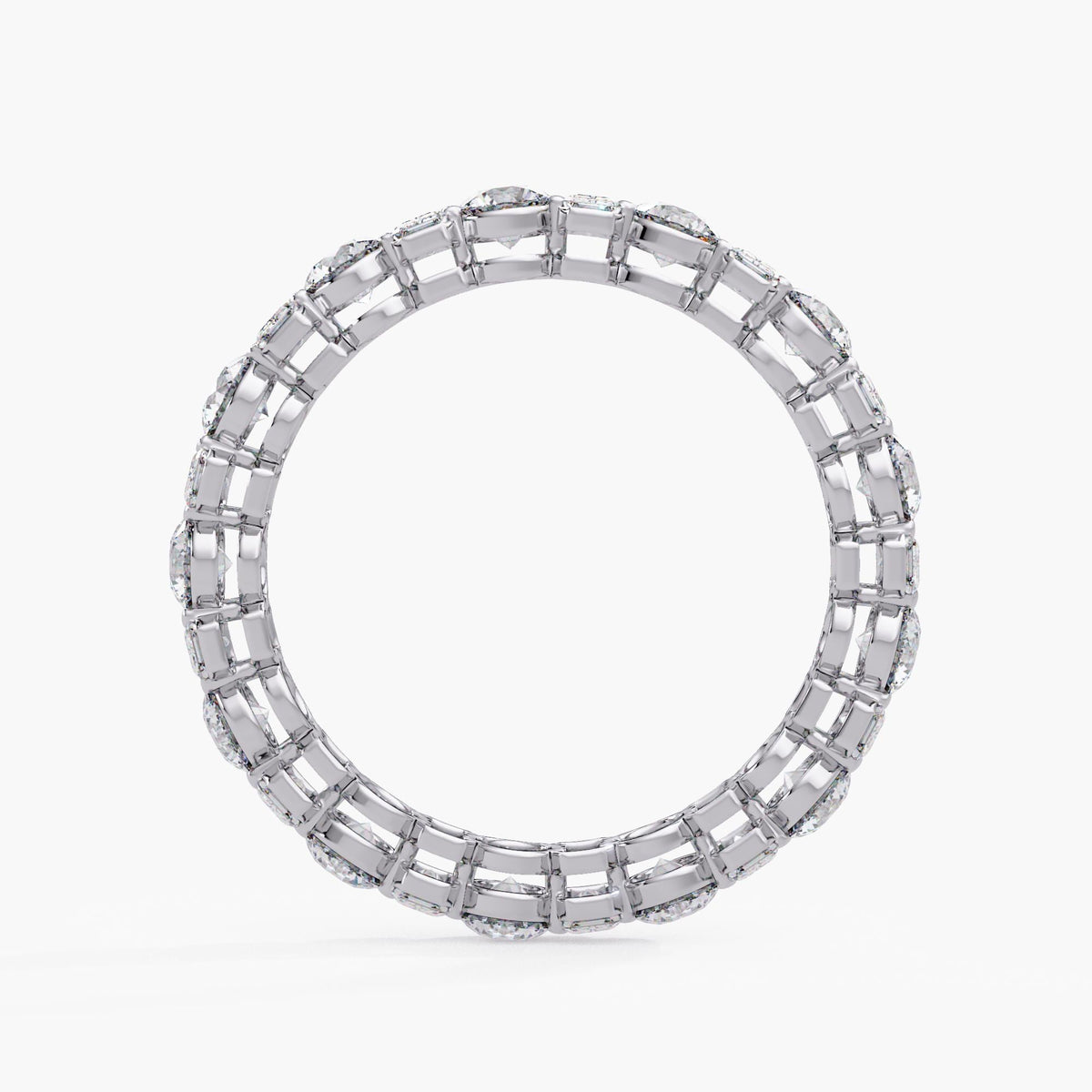 14K white gold eternity ring showing the full circular structure and open gallery beneath alternating prong-set round and emerald-cut lab-grown diamonds.