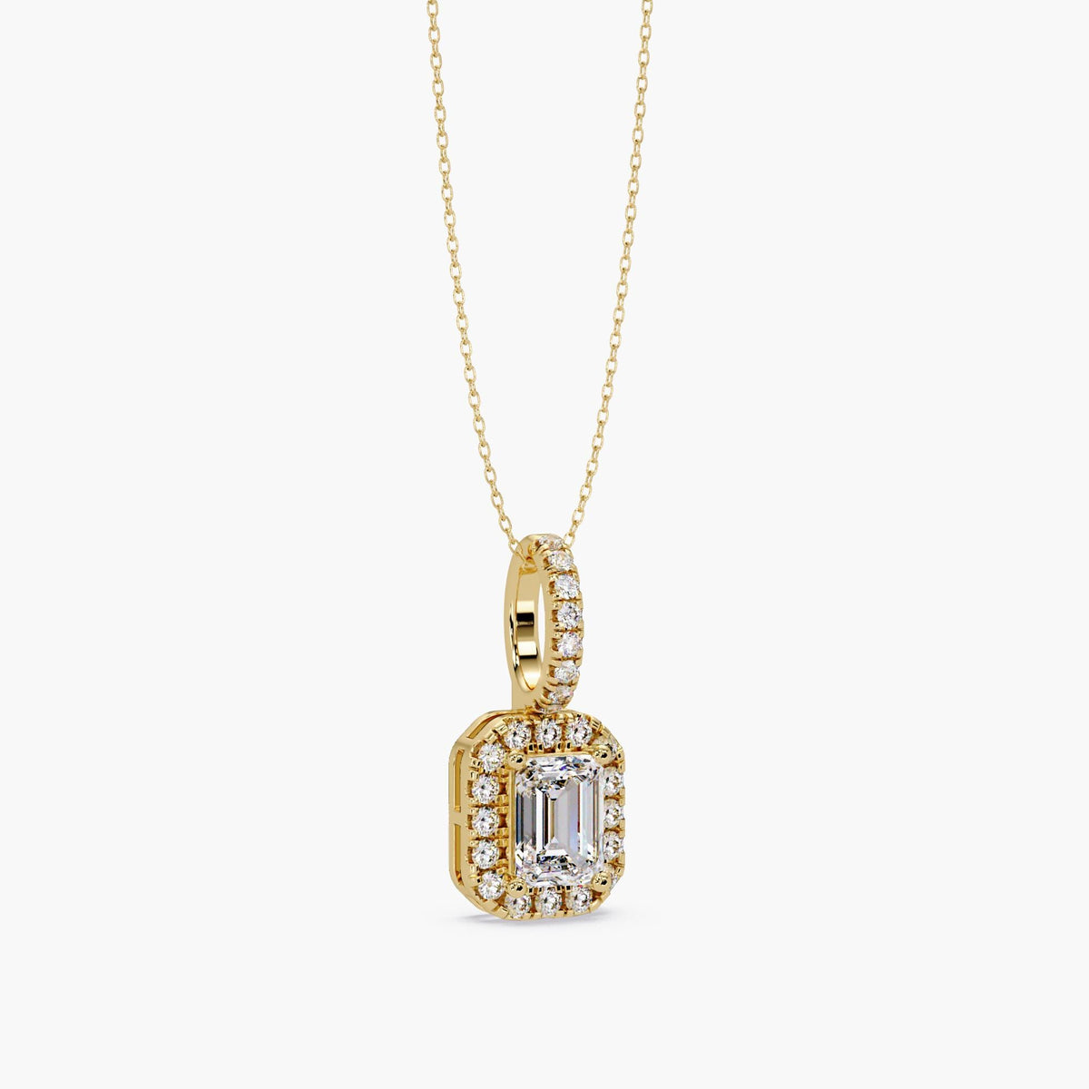 14K yellow gold emerald cut diamond halo pendant on pavé diamond bail, side view showing prong setting and dainty cable chain