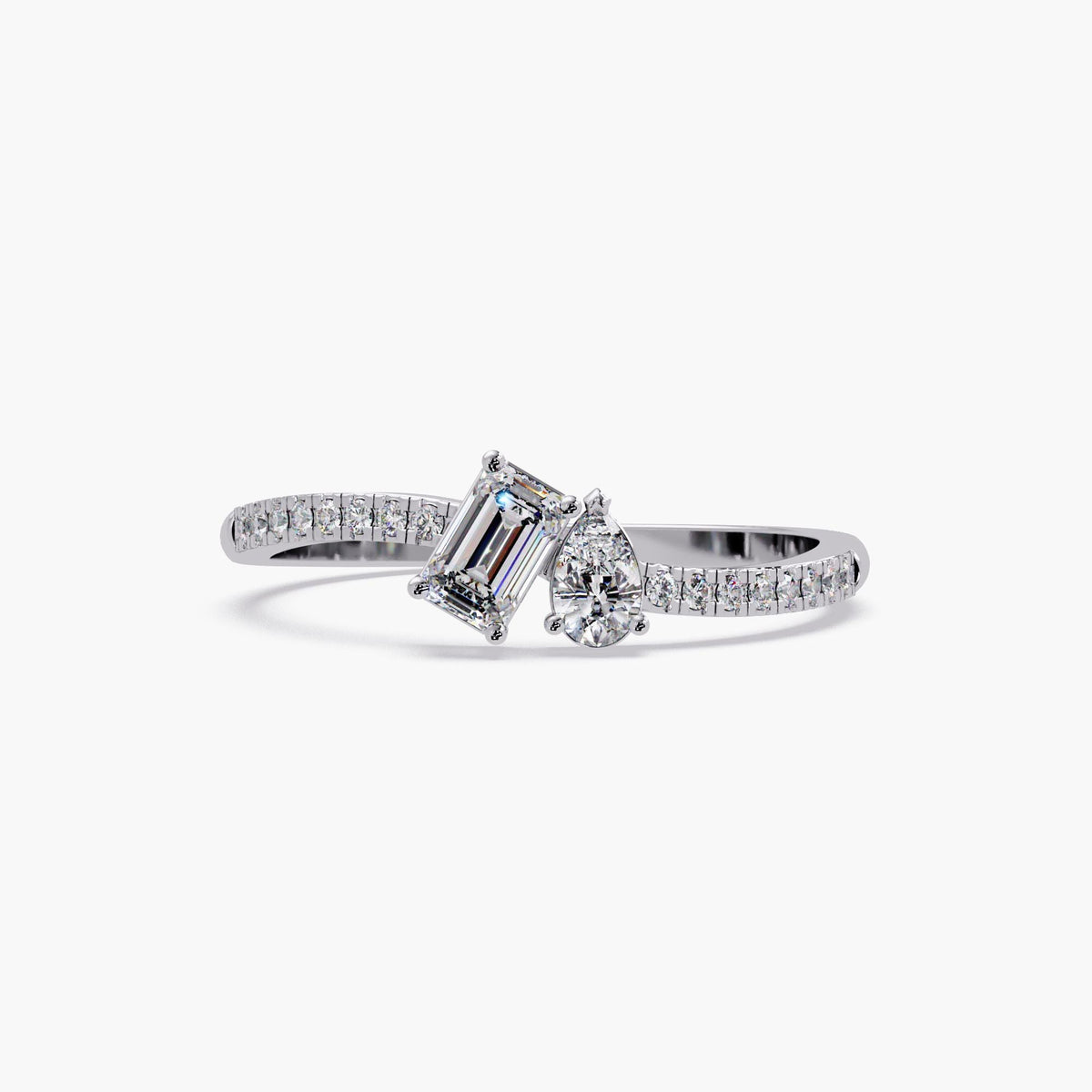 14K white gold toi et moi ring with emerald cut and pear cut lab diamonds on a pavé diamond band, modern bypass two stone engagement or anniversary ring