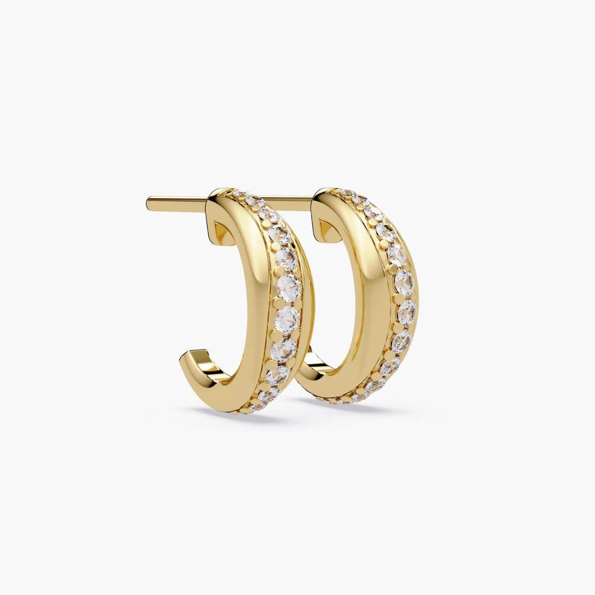 14K yellow gold dome stud hoop earrings shown from side view, channel set with natural round diamonds, chunky huggie design with post back closure, fine jewelry hoops for everyday wear or gifting.