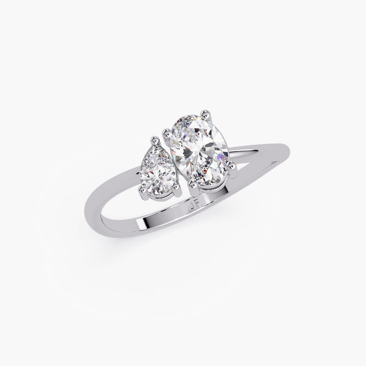 Toi et Moi ring with oval and pear lab diamonds in a curved band