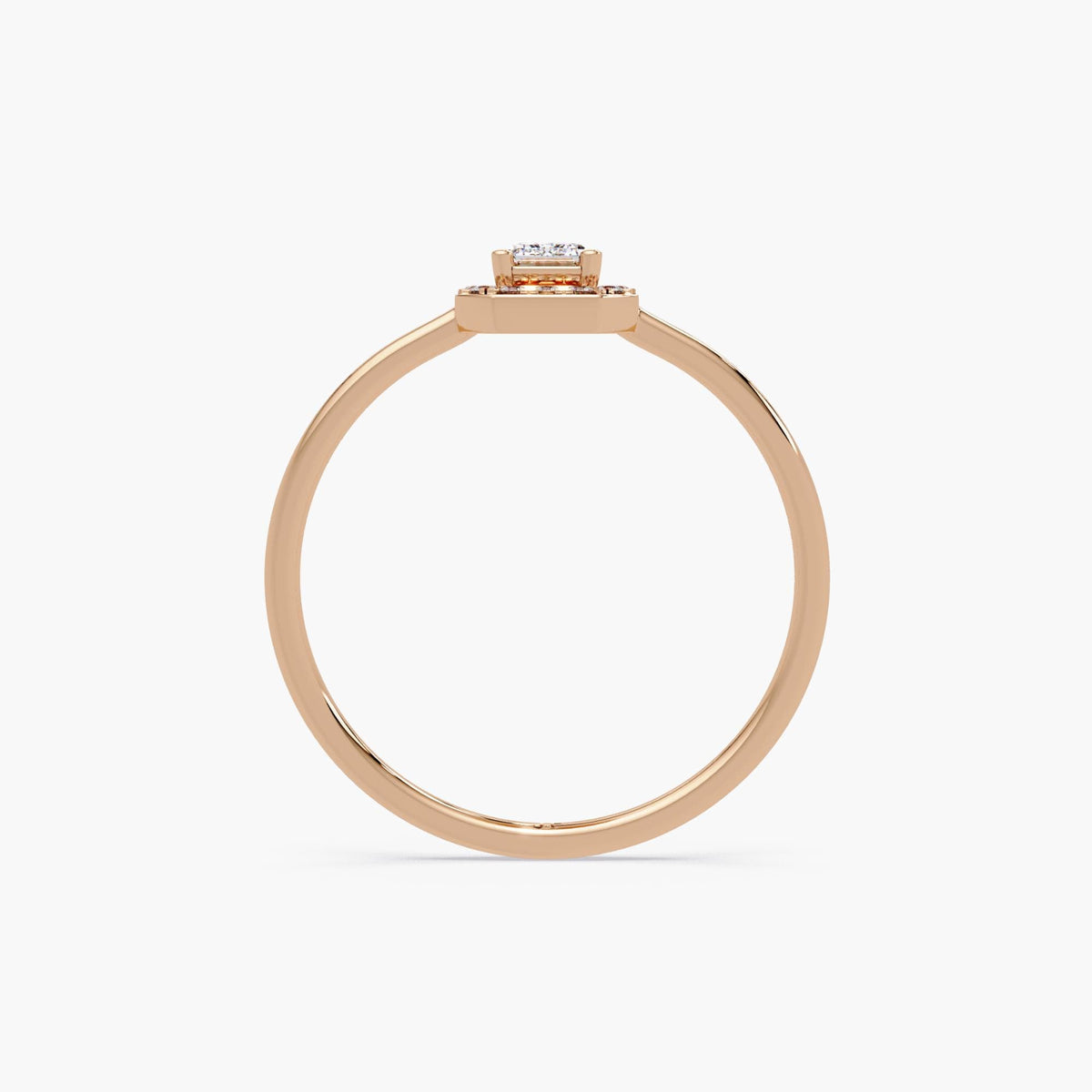 slim rose gold ring with raised emerald-cut lab diamond and halo, minimalist band and clean modern setting