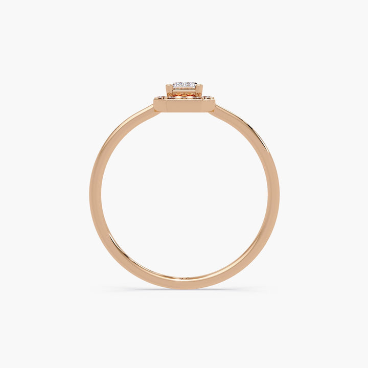 slim rose gold ring with raised emerald-cut lab diamond and halo, minimalist band and clean modern setting
