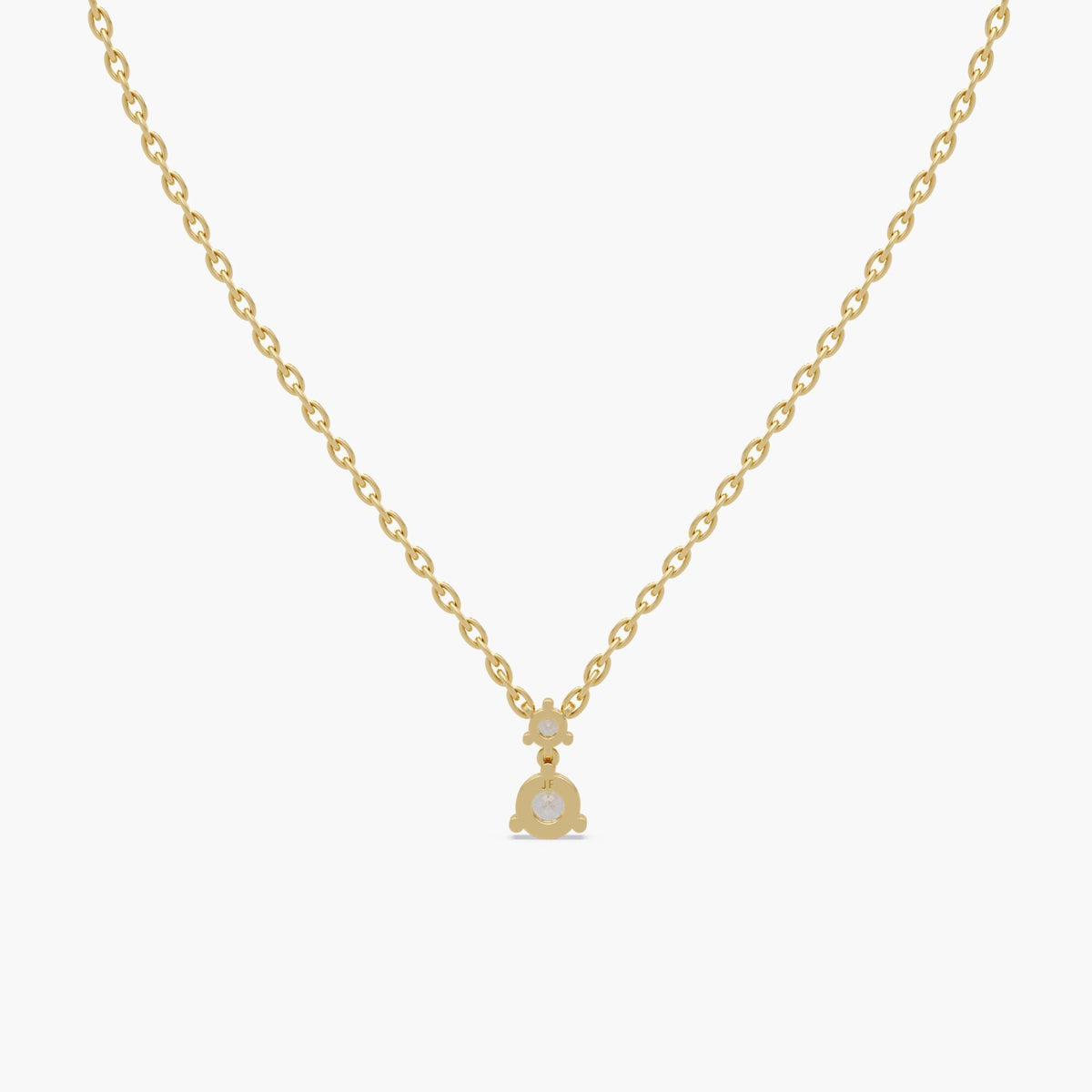 Solid 14K yellow gold drop necklace featuring floating lab diamond duo pendant on fine chain
