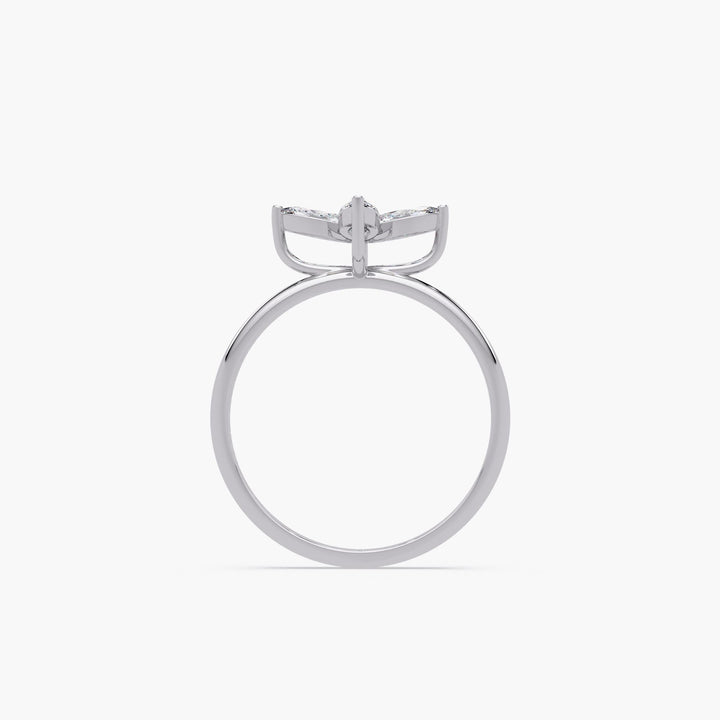 diamond clover ring in white gold showing raised setting and slim polished band