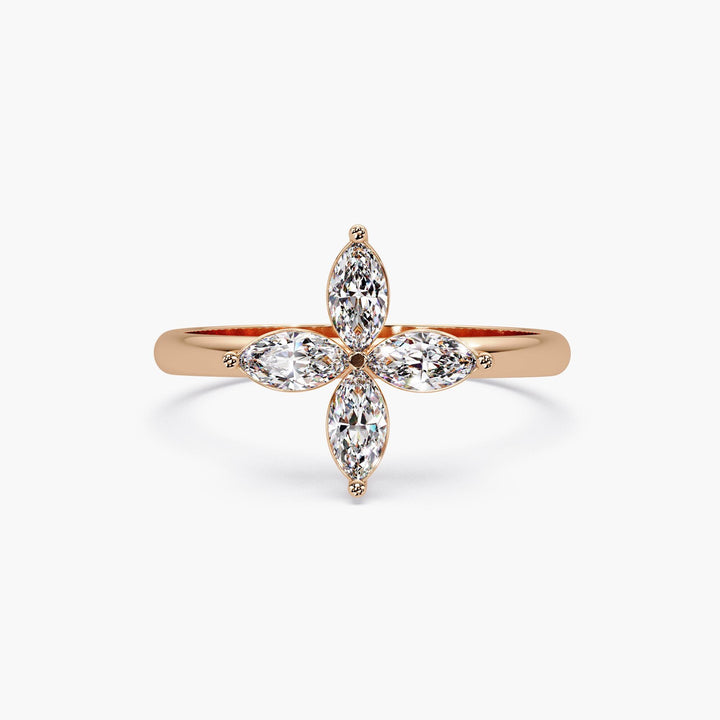 Rose gold diamond clover ring with four marquise diamonds in a floral cross design on a polished solid gold band