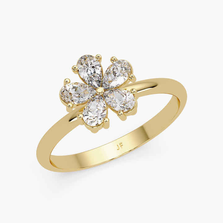 diamond petal ring in 14K yellow gold with pear cut stones in a flower cluster, sculptural gift jewelry