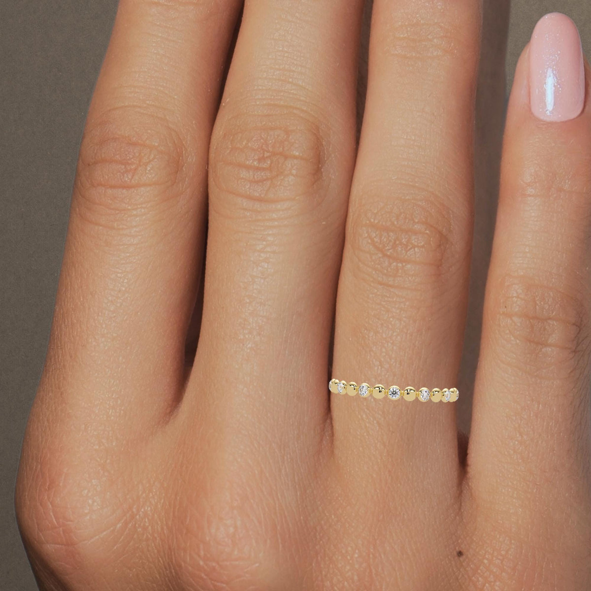 Dainty 14K gold bubble diamond band worn on finger, natural diamond dot ring for stacking or gifting