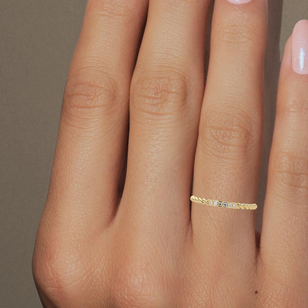 Slim solid gold anniversary band with delicate pavé stones