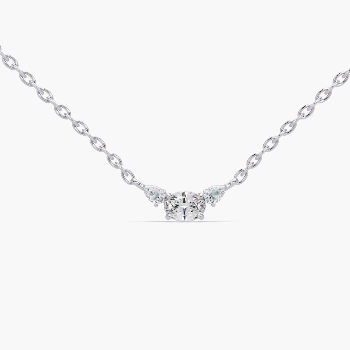 14K white gold necklace with three sparkling lab-grown diamonds, oval center stone framed by pear accents, timeless dainty diamond pendant ideal for wedding day jewelry, everyday minimalist style, or luxury anniversary gift for her.
