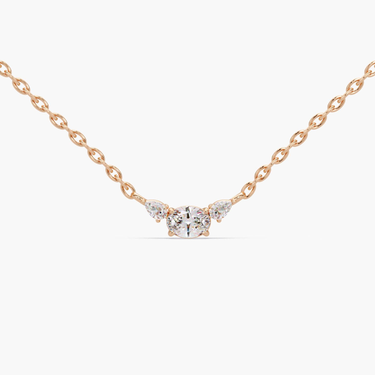 Romantic 14K rose gold three stone necklace with oval lab-grown diamond center and pear side stones, dainty diamond pendant perfect for weddings, bridesmaid gifts, or everyday layering jewelry for women