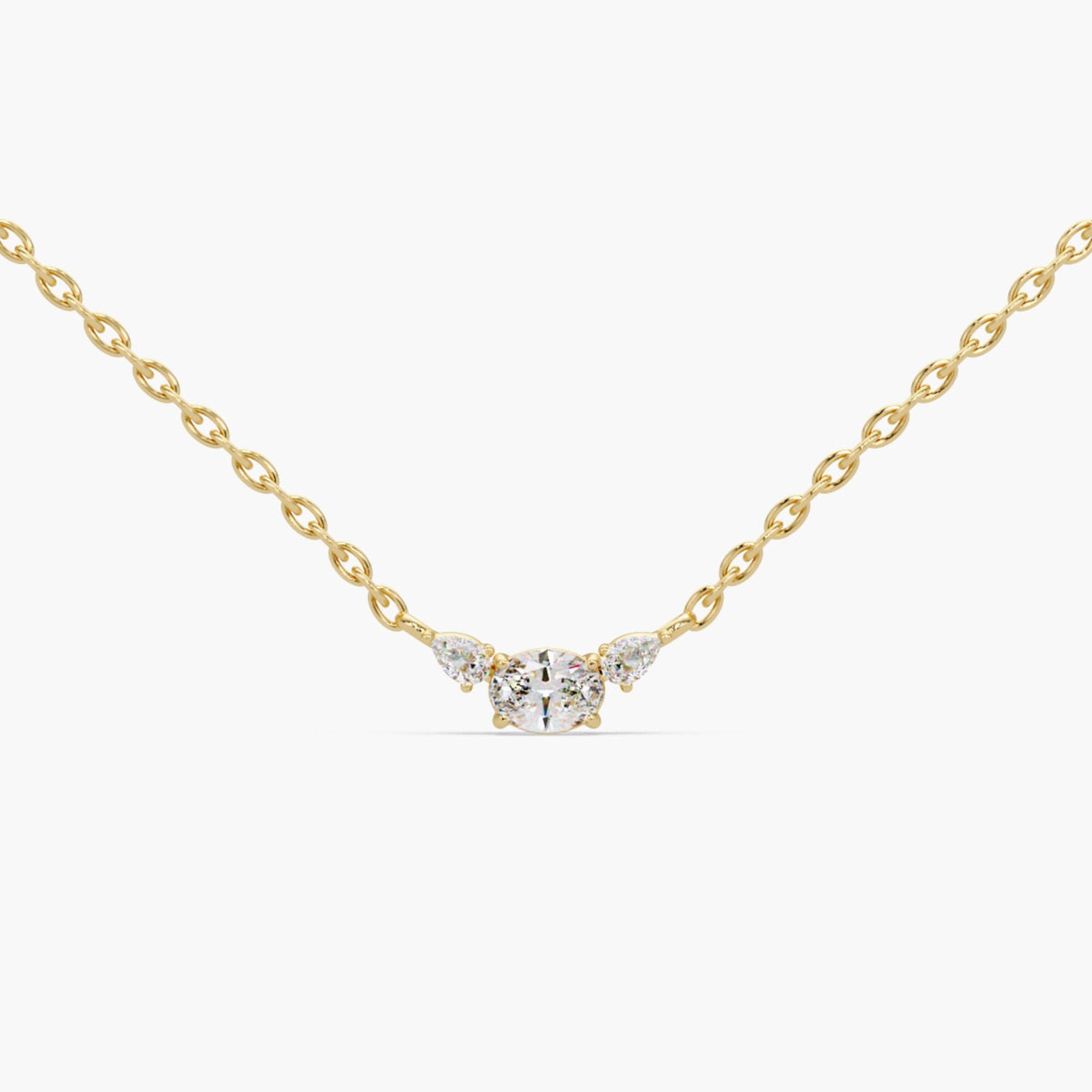 14K solid gold three stone necklace featuring an oval lab-grown diamond with pear diamond accents in a prong setting, dainty and minimalist pendant design perfect for bridal jewelry, anniversary gift, or everyday layering necklace for her.