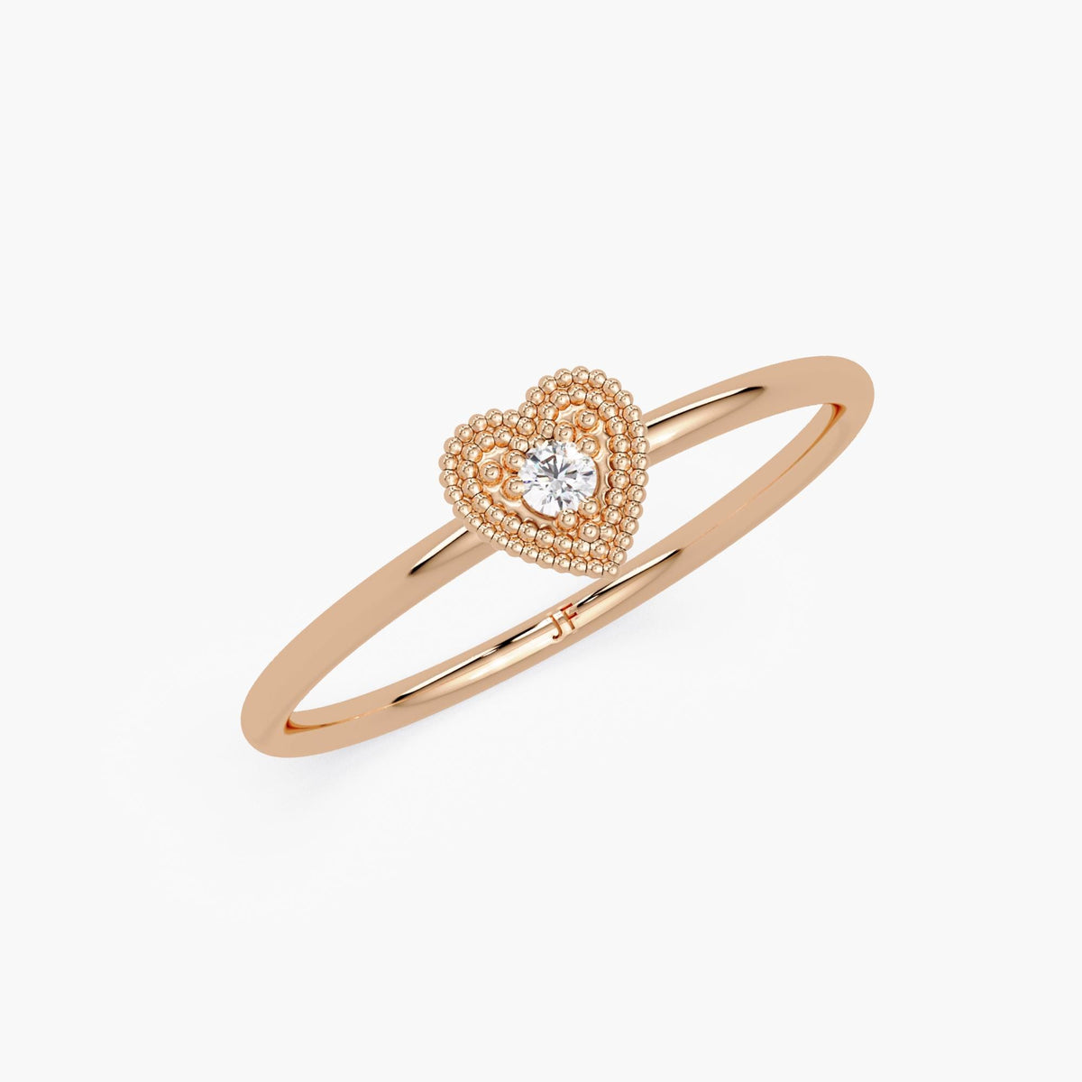 A minimalist promise ring made of 14k rose gold with a delicate heart design and a natural diamond accent.