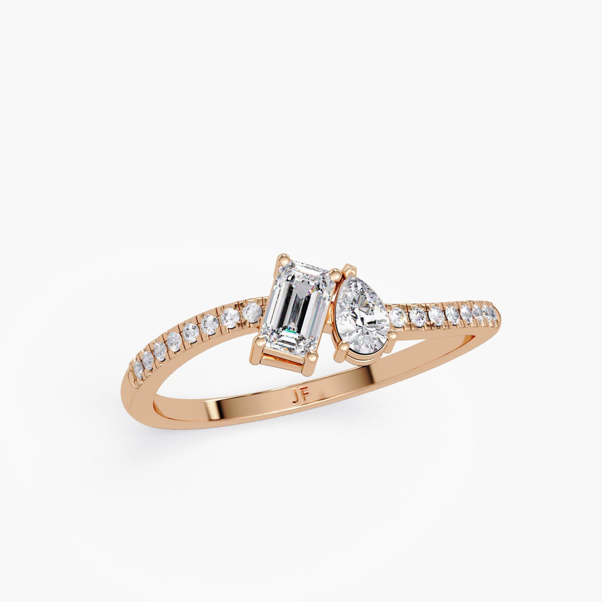 14K rose gold toi et moi engagement ring featuring emerald cut and pear cut lab grown diamonds on pavé diamond band, modern two stone ring by Jewel Frost