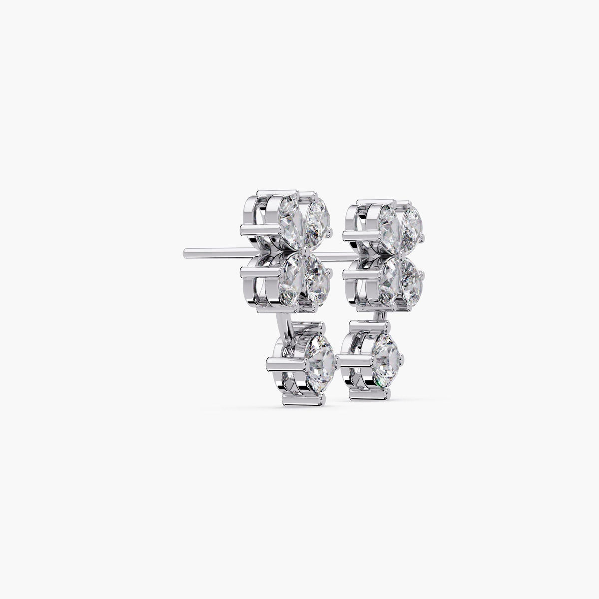 white gold clover diamond earrings featuring pear-cut lab-grown diamonds in a floral cluster and prong-set round diamond drop. Sculptural 14K solid gold setting with secure push-back post, showcasing depth and craftsmanship.