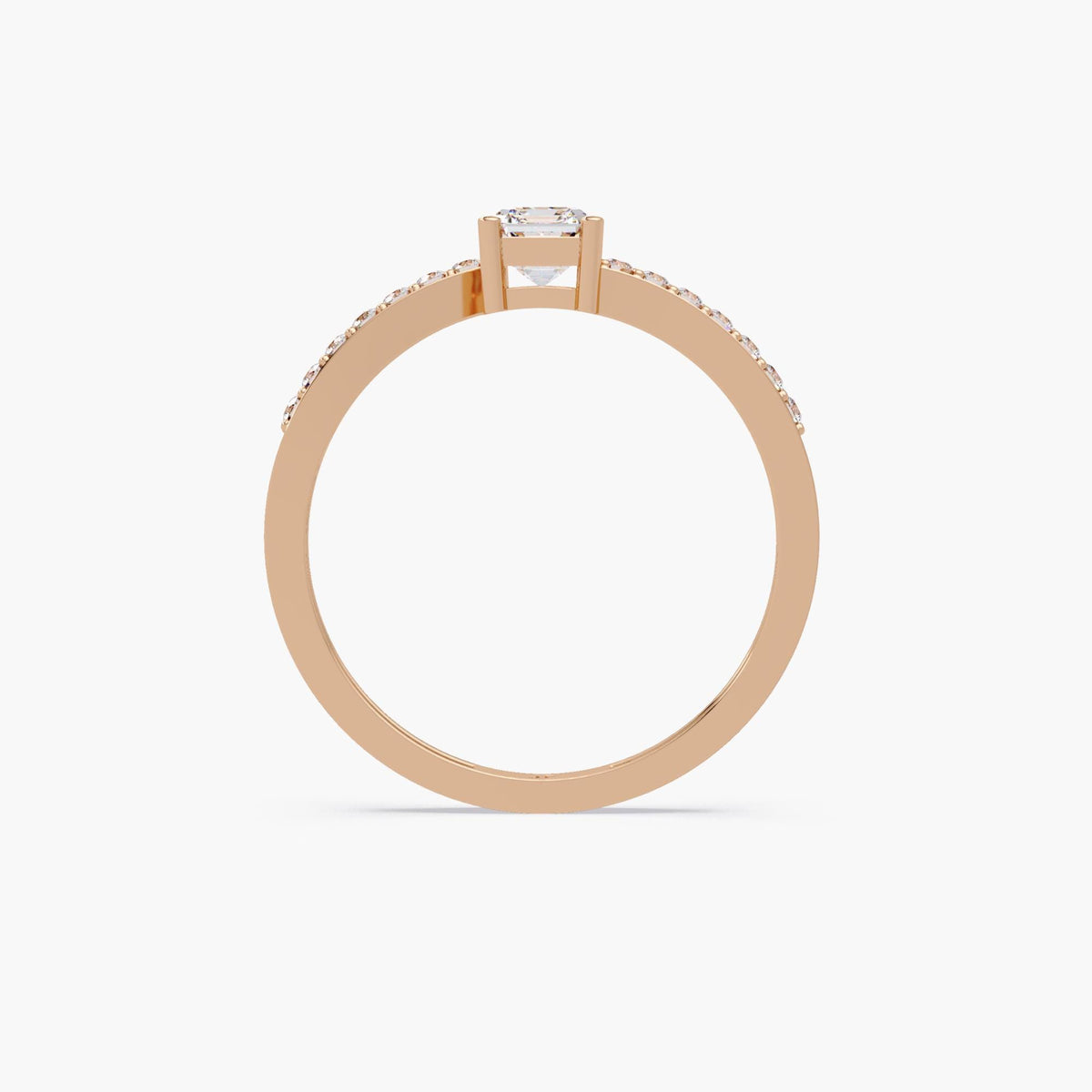 rose gold emerald cut engagement ring, 14K gold four prong setting with pavé diamond band, minimalist solitaire design.