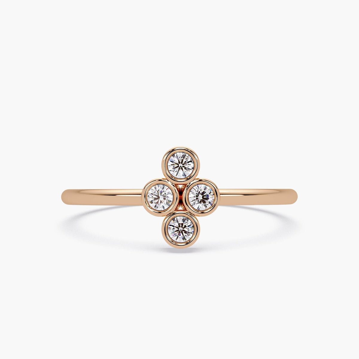 14k rose gold four stone diamond ring with bezel set natural diamonds.