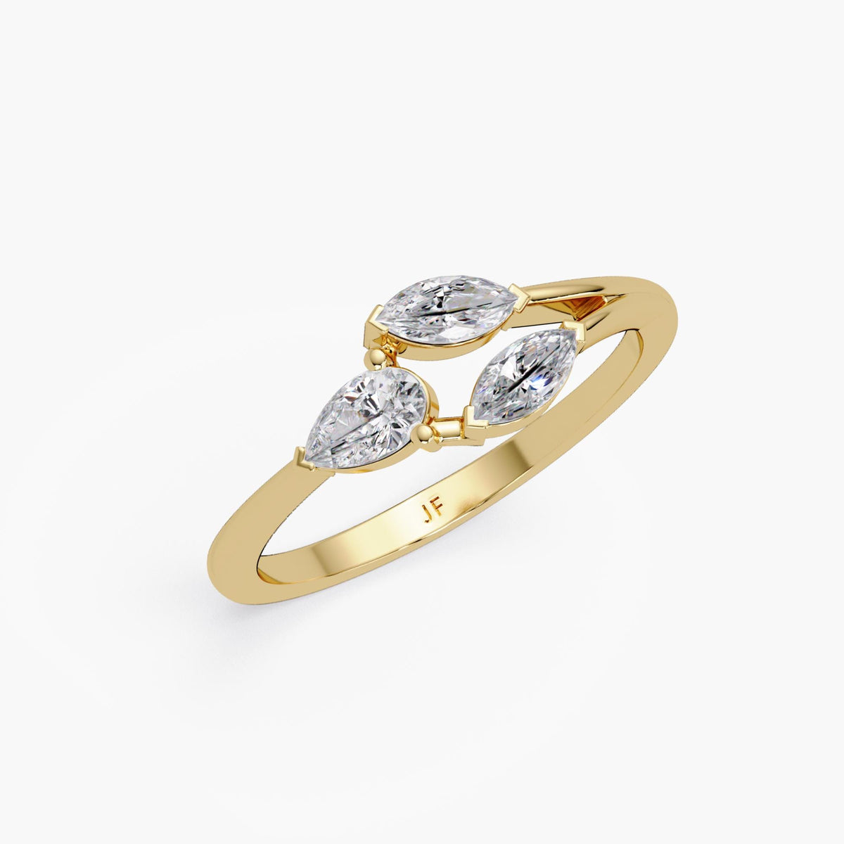 floral-inspired 14K yellow gold ring featuring three prong-set lab-grown diamonds — one pear and two marquise cut — arranged in a petal-like design.