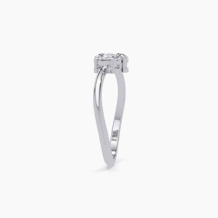 14k white gold Toi et Moi ring with oval and pear lab diamonds in an open setting, showing band curvature and height