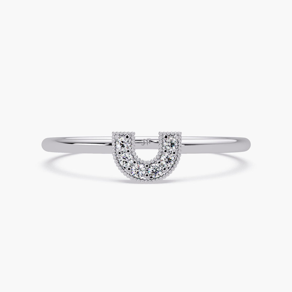Slim U shape gold band with sparkling pavé diamonds styled as a lucky charm.