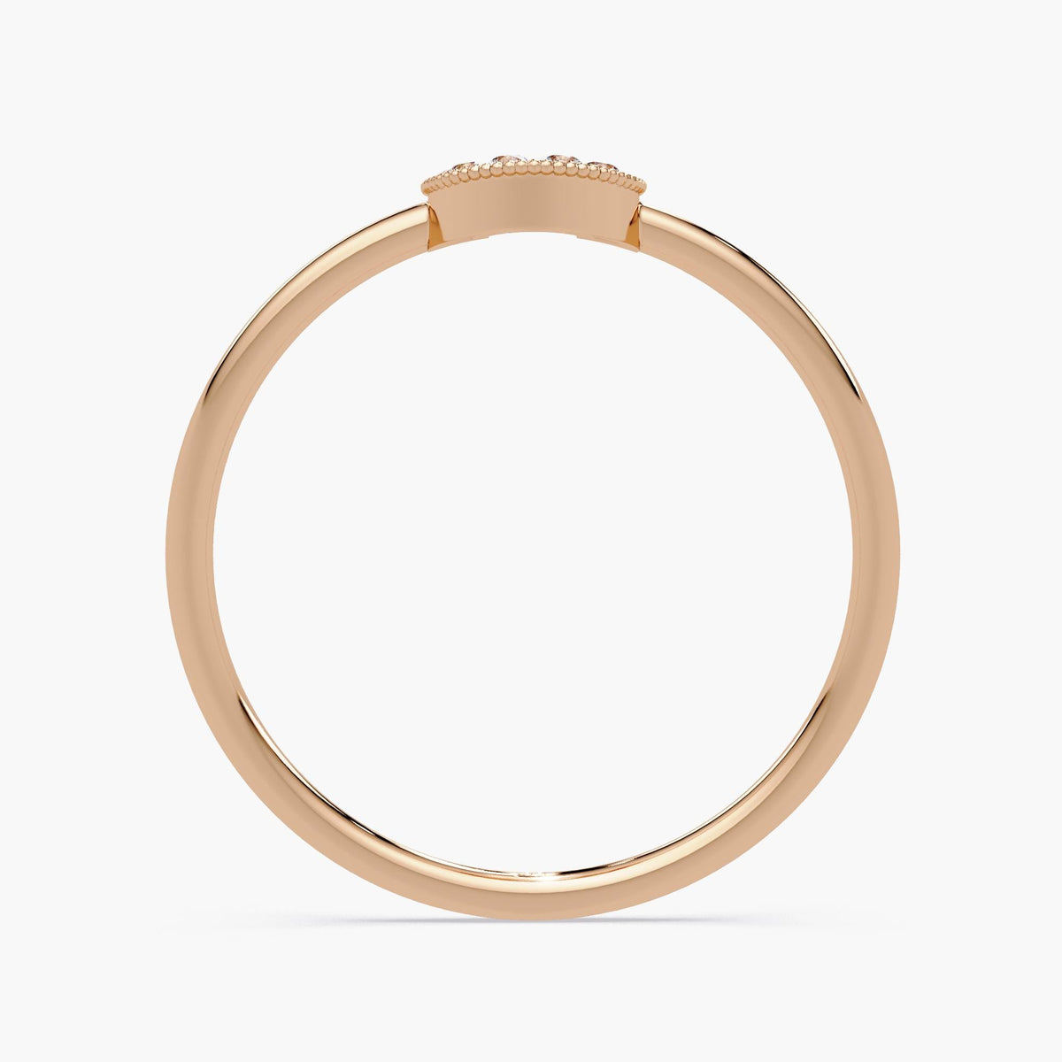 Minimalist horseshoe diamond ring worn as a dainty stacking band.