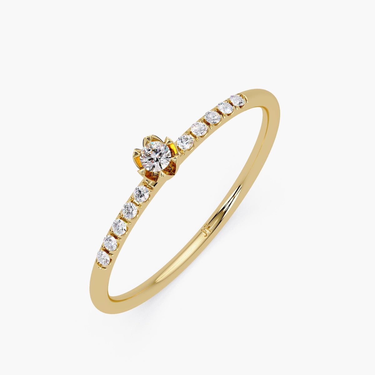 Thin diamond wedding band photographed with engagement ring stack