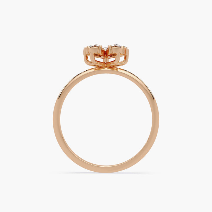 14K rose gold ring with sculptural floral basket setting, showing elevated diamond cluster in petal design