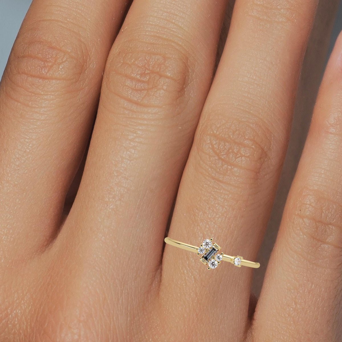 Modern half bezel and prong set diamond ring, baguette and round cuts in 14k gold
