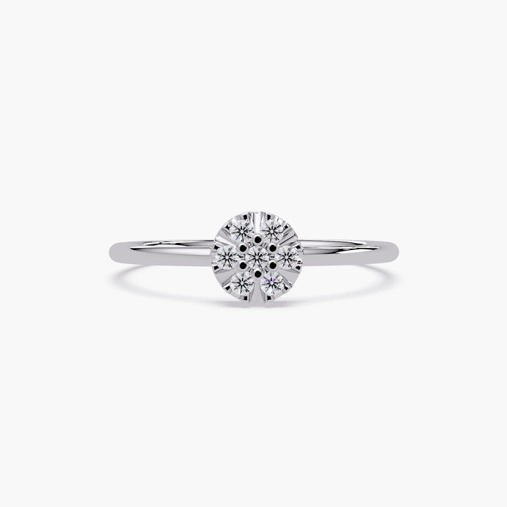 Minimalist cluster ring in solid gold featuring delicate round diamonds.