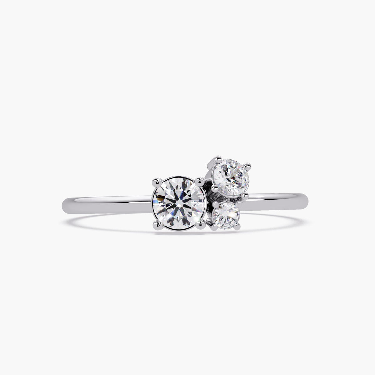 14k white gold three-stone lab diamond ring with round brilliant-cut diamonds in a dainty graduated cluster setting and slim polished band