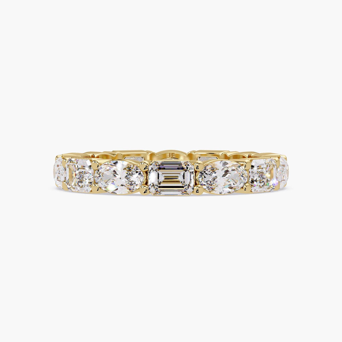 14k gold oval and emerald cut diamond eternity band.
