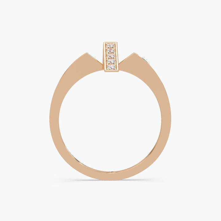Close-up of minimalist 14K gold bar ring with diamonds.