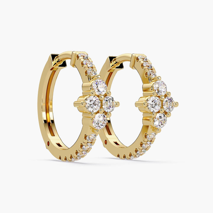 14K yellow gold hoop earrings on a white background, featuring a floral or clover-shaped cluster of lab-grown diamonds at the front.