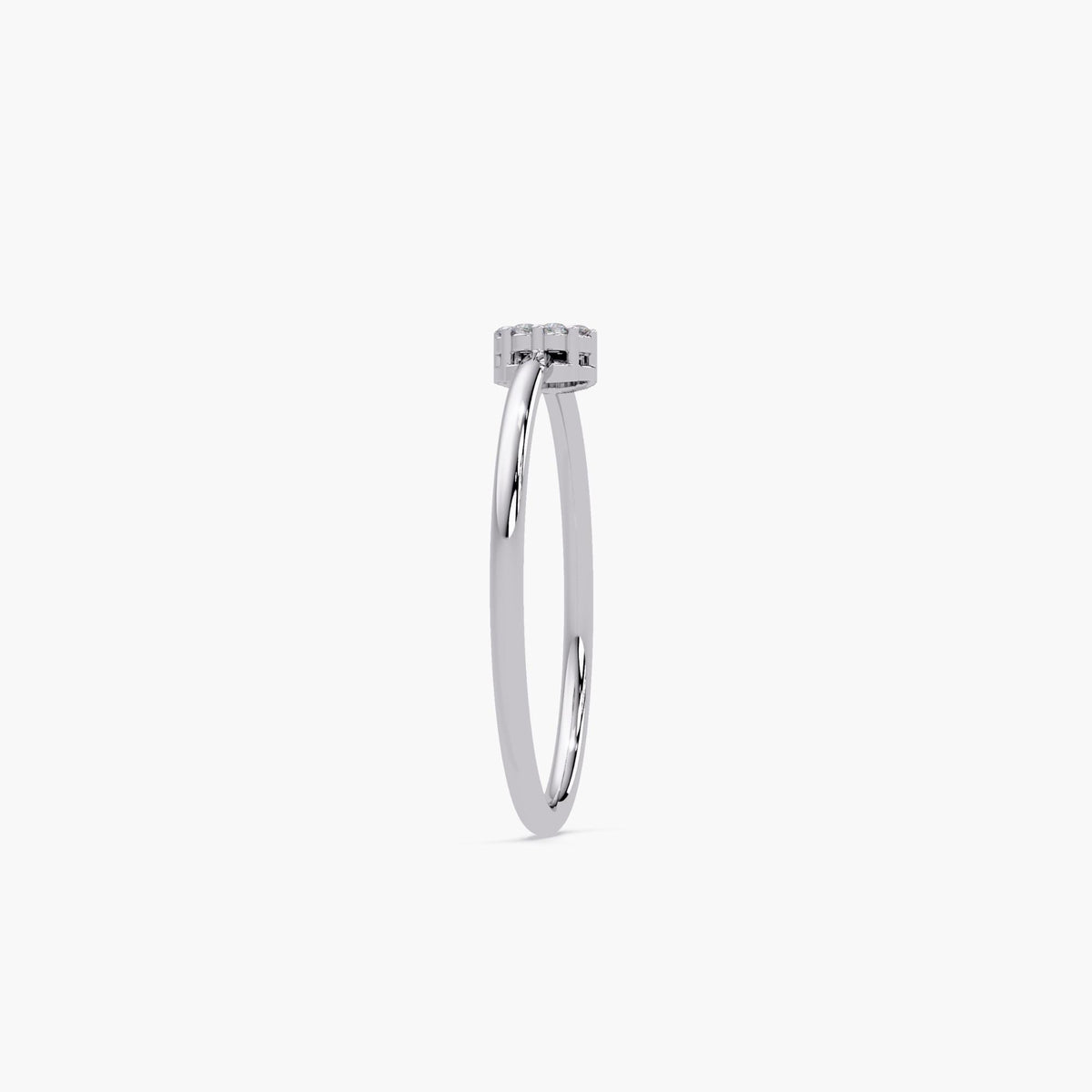 The thin solid gold band holds a brilliant round diamond cluster in a prong setting.