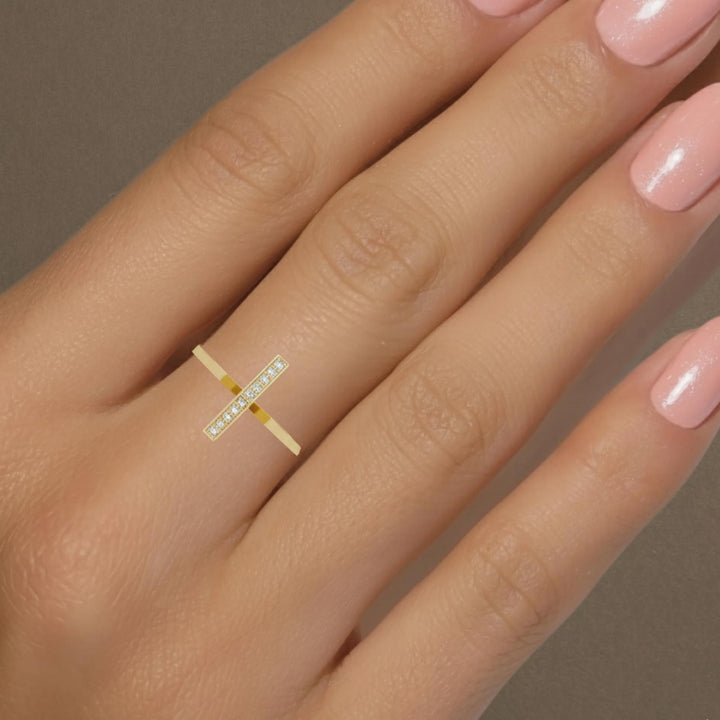 Modern stacking ring with diamonds in a slim gold band.