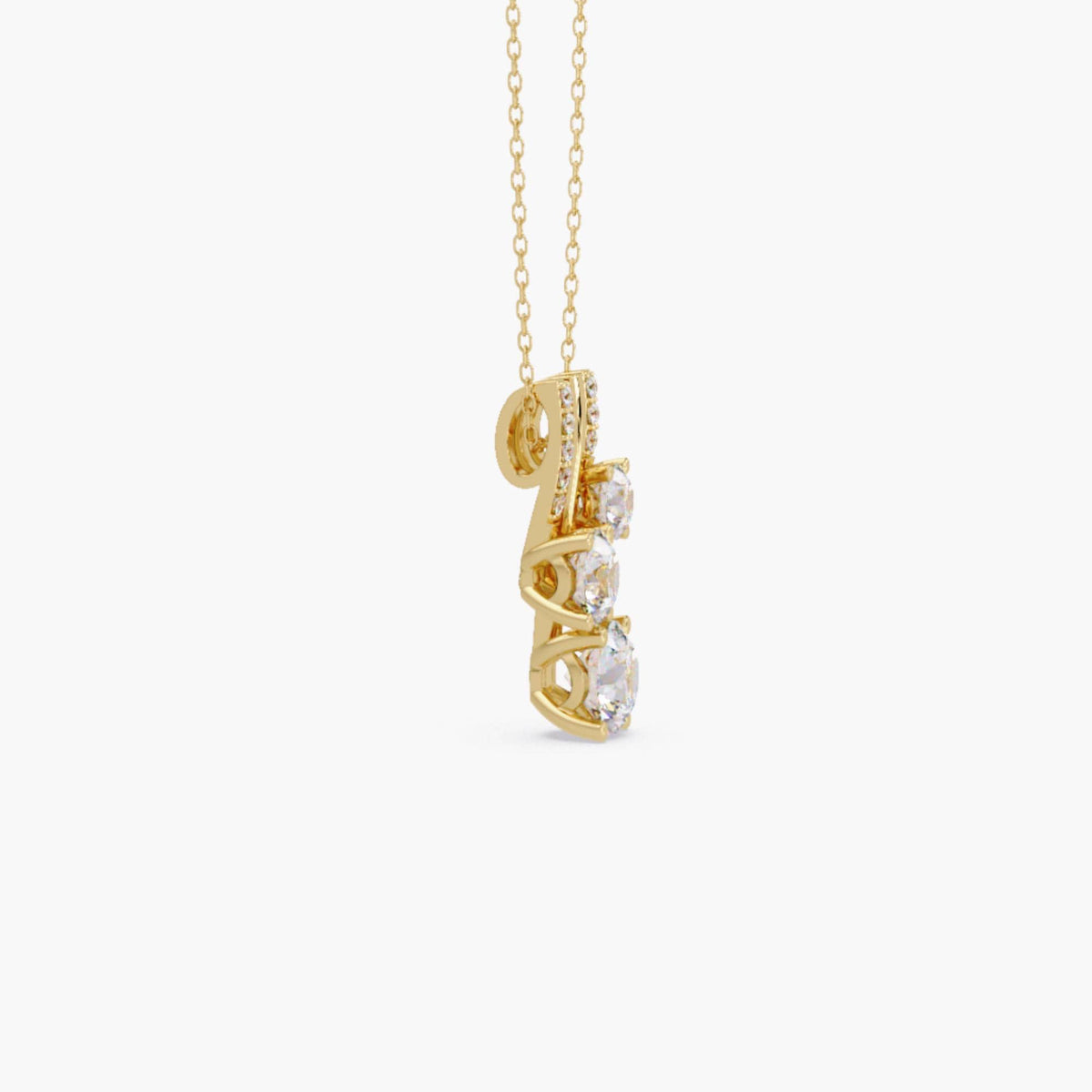 Side view of 14K gold diamond pendant necklace showing trio round brilliants in prong setting with pavé bar accents