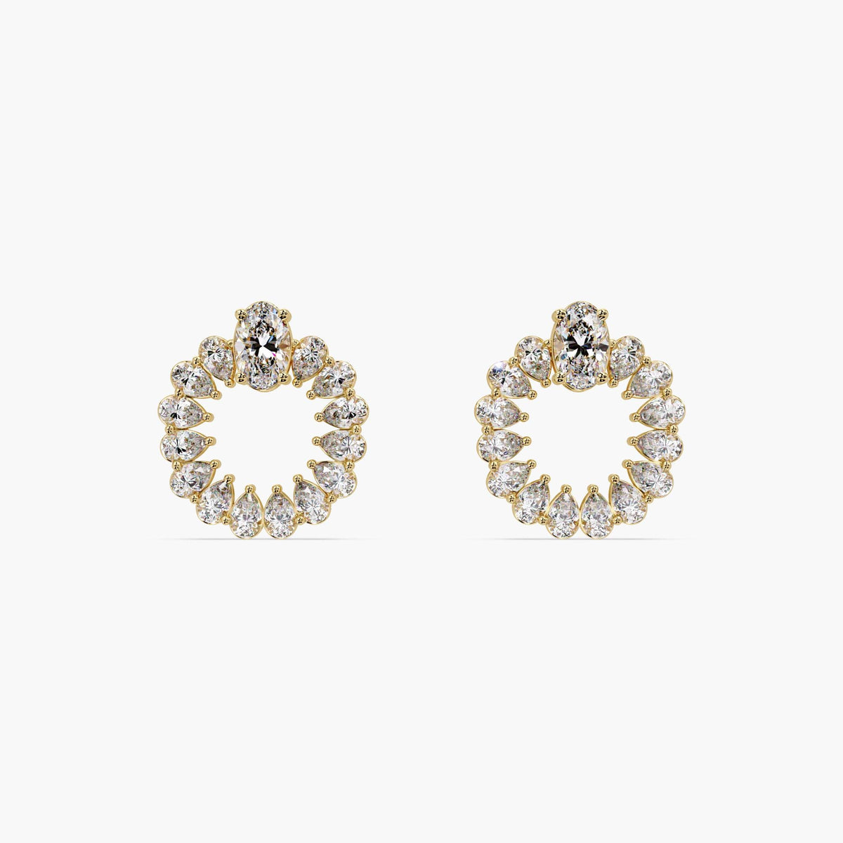 Close-up of oval and pear diamonds forming a circular hoop design.