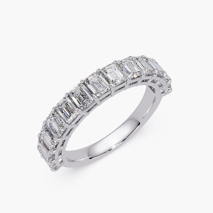 Minimalist diamond eternity ring with emerald cut stones.